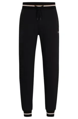 Cotton-terry tracksuit bottoms with logo in signature colors