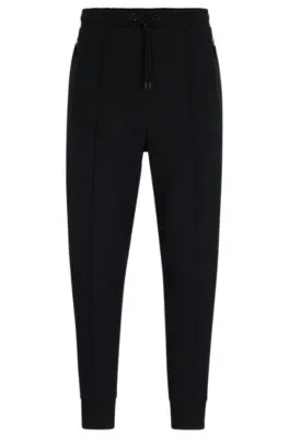 Tracksuit bottoms with pixelated details